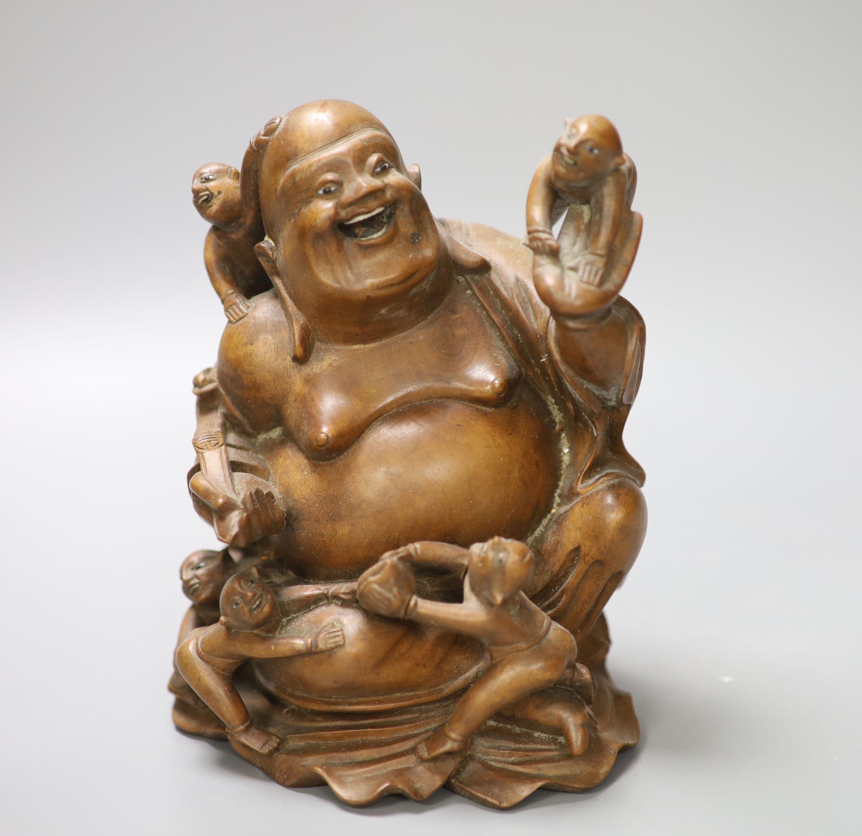 A Chinese carved hardwood figure of Budai, height 17cm